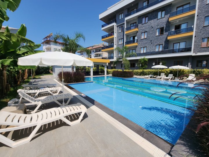 Prostrani 2+1 stan s bazenom, teretanom i društvenim sadržajima u modernoj rezidenciji