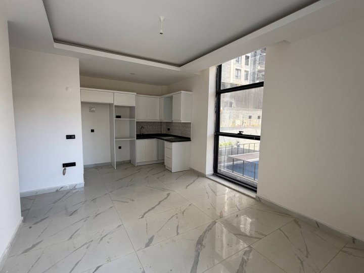 Apartament z 1 sypialnią na sprzedaż z basenem, blisko morza w Mahmutlar, Alanya