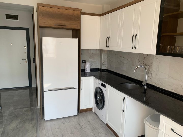 مرسين أردمي توموك: شقة بغرفتي نوم مع مسبح وإطلالة على البحر للبيع