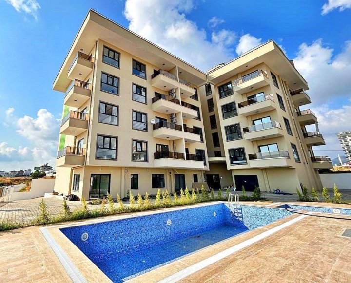 Appartement 2 chambres au centre-ville à Payallar, Alanya avec salle de gym et vue sur la mer