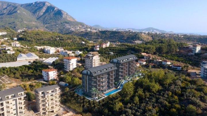 Inwestuj w apartament w Alanya Oba: Zawiera basen i kino