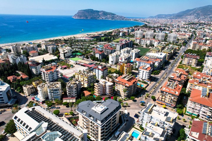 Zainwestuj w apartament z basenem i widokiem na morze w Obie, Alanya