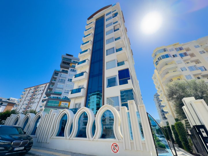 Apartament z jedną sypialnią na sprzedaż w pobliżu plaży w Mahmutlar, Alanya z basenem