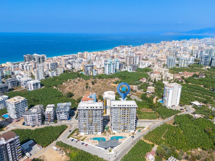 Mieszkanie z jedną sypialnią na sprzedaż blisko plaży w Mahmutlar, Alanya z basenem